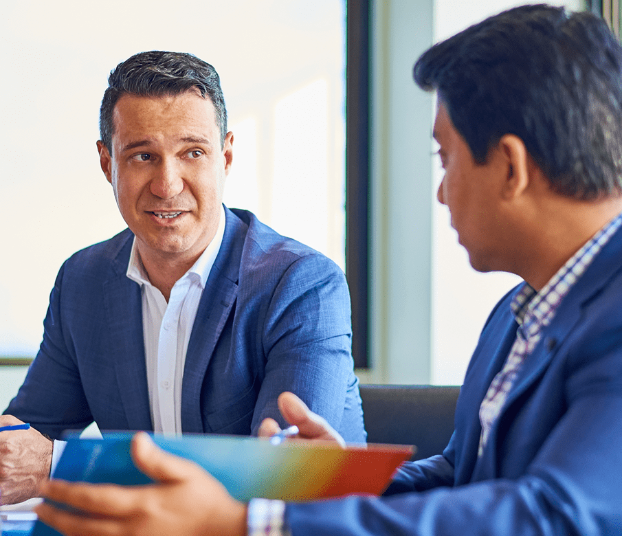 Director, business advisory of The Practice with another employee.